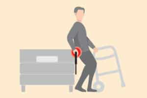 Digital illustration of a man struggling to transfer out of bed to his walker with red highlights indicating a strained position on his wrist.
