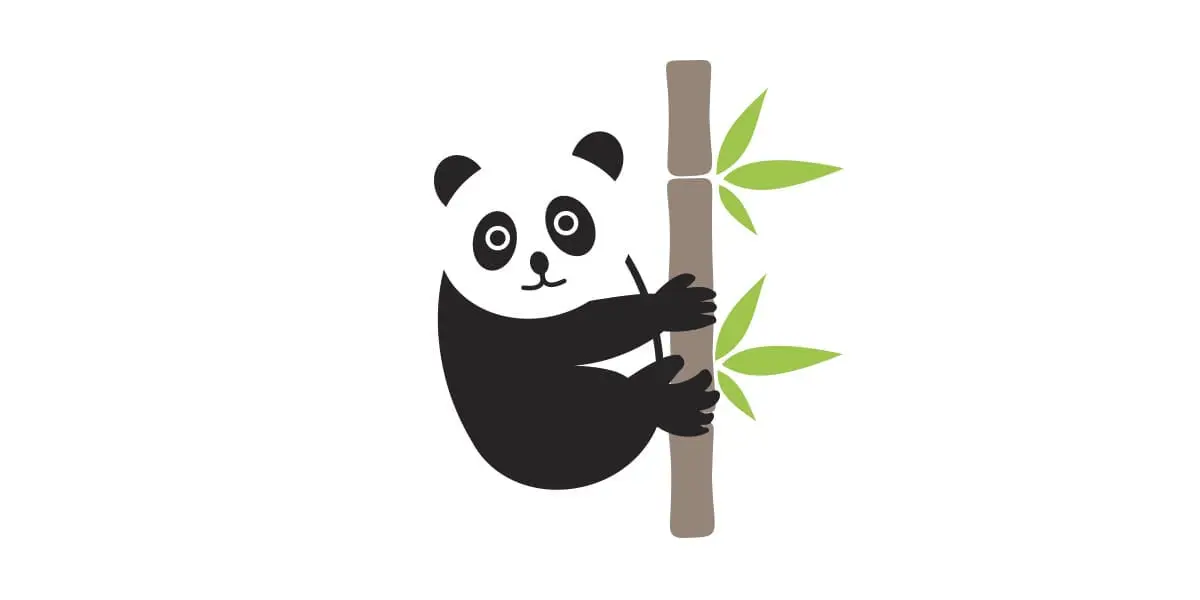 A panda holding onto bamboo tree