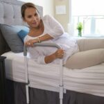 Woman using the Smart-Rail to sit up from bed