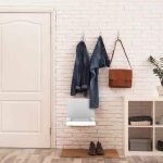 Fold Down Seat installed in a foyer to help take shoes on and off
