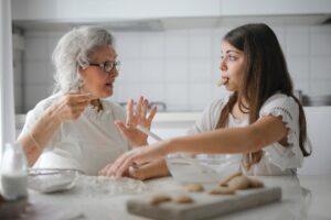 Grand mother cooking with grandkids