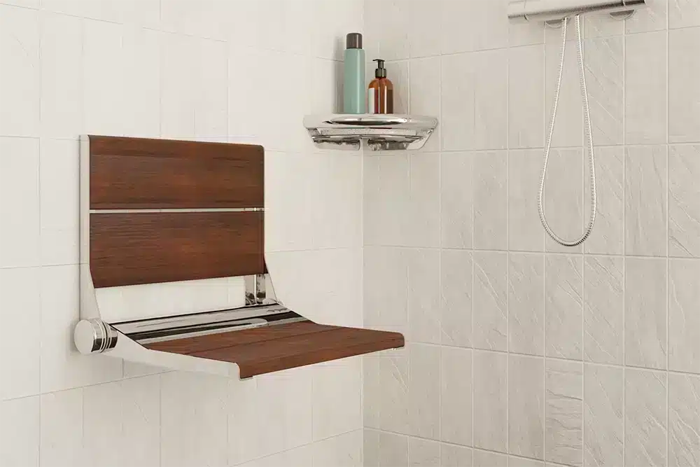 The serenaseat ready for use in the shower, with a corner shelf in the background